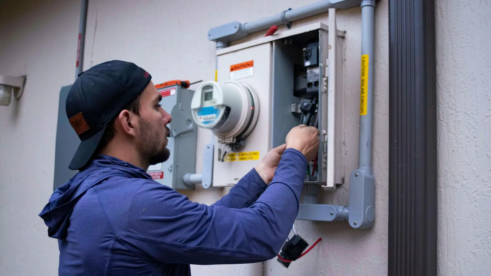 Emergency HVAC technician checking indoor AC system